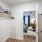 a bedroom with a bed and a mirror