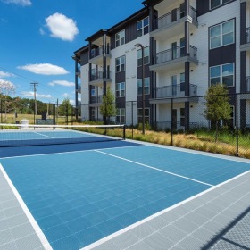 The essence of exceptional living a tennis court in front of a building