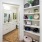 a room with a mirror and shelves